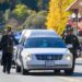 The honor guard walks with the hearse for fallen El Dorado County Sheriff s Deputy Brian Ishmael during his funeral procession in downtown Placerville on Tuesday, Nov. 5, 2019.