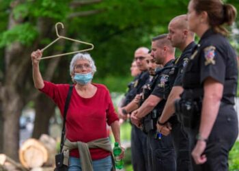A pro-choice campaigner protests outside US Supreme Court Justice Brett Kavanaugh’s home.