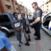 Dallas police sergeant A. P. Martin talks with kids while performing community patrol at the Cielo Ranch apartments in Southwest Dallas, Sunday, July 10, 2016.
