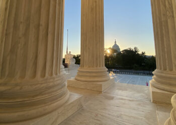 View of U.S. Capitol with sunset from Supreme Court steps