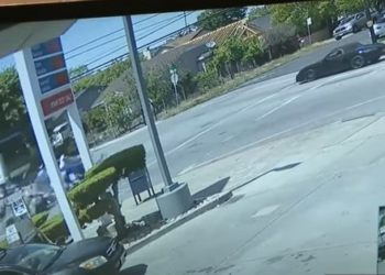 Motor officer sent flying, is injured after car runs stop sign