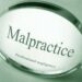 malpractice words and magnifying glass