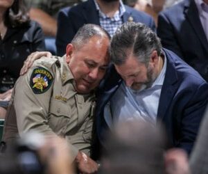 Uvalde County Sheriff Ruben Nolasco, left, is comforted by U.S. Sen. Ted Cruz.