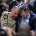 Uvalde County Sheriff Ruben Nolasco, left, is comforted by U.S. Sen. Ted Cruz.