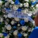 A wreath is displayed at a memorial outside El Monte City Hall Wednesday, June 15, 2022, after two police officers were shot and killed Tuesday, at a motel in El Monte, Calif.