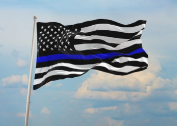 Neighbors fly thin blue line flags after HOA tells slain officer’s father to take his down