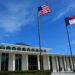 The North Carolina Legislative Building with the North Carolina and U.S. flags flying