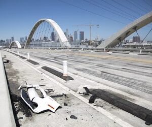 Car debris from a takeover crash remains on the 6th Street Viaduct on Tuesday, July 19, 2022 in Los Angeles, CA.