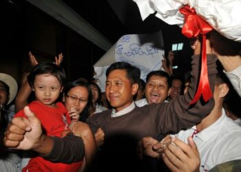 Kyaw Min Yu (centre), known as Ko Jimmy, photographed after being released from prison in 2012.