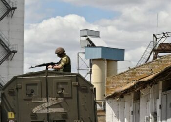 A Russian serviceman guarding a grain elevator in Melitopol on 14 July.