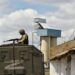 A Russian serviceman guarding a grain elevator in Melitopol on 14 July.