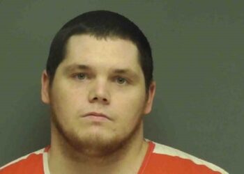 Austin Patrick Hall, 26, was arrested after an hours-long manhunt following the shooting of two Alabama sheriff's deputies, one of whom died, authorities said. 