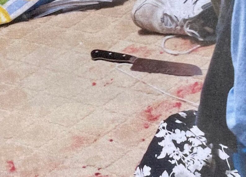 Blood and a large kitchen knife are seen inside the suspect's master bedroom after he was shot by a deputy.