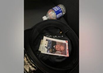 A photo shows a bullet lodged in the blood stained hat worn by a Philadelphia police officer who was shot in the head on July 4, 2022.