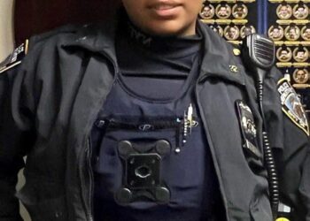 NYPD officer Arianna Gomez stands in uniform.