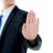 stop sign businessman holding up hand stop gesture