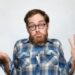 stupid confused shrug man with beard idiot moron dunce hipster