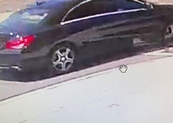 U.S. Postal Inspection Service (USPIS) spokesman Michael Martel showed an image at a press conference of a black Mercedes believed to be the suspect vehicle in an armed robbery on a mail carrier in Northwest Washington, D.C.