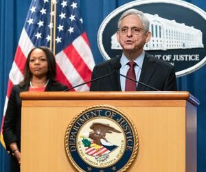 Attorney General Merrick Garland with Assistant Attorney General Kristen Clarke for the Civil Rights Division, speaks during a news conference at the Department of Justice in Washington, Thursday, Aug. 4, 2022.