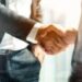 Businessman handshake for teamwork of business merger and acquis