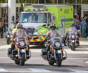 Police escort the body of Miami-Dade Police Detective Cesar Echaverry from Jackson Memorial Hospital to the Miami-Dade County Medical Examiner’s Department on Friday, Aug. 19, 2022.