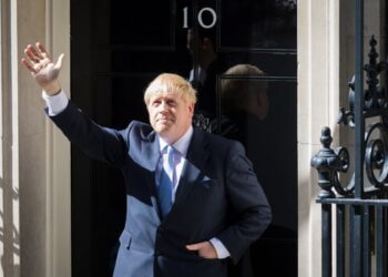 Boris Johnson waves as he enters 10 Downing Street after his appointment, 24 July 2019.
