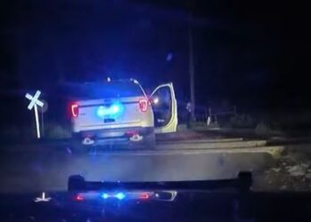 Video shows train slam into Colo. police vehicle with woman inside