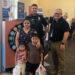 Arkansas police department gives new shoes to students in annual giveaway event