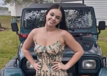photo of Gabby Carrigan in a dress posing