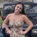 photo of Gabby Carrigan in a dress posing