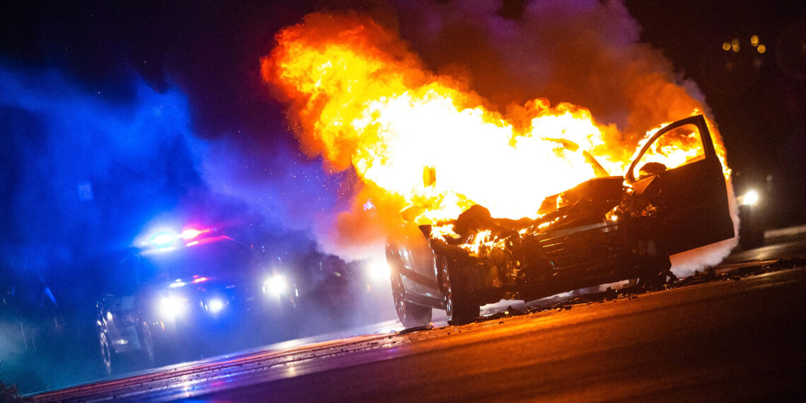 Oregon police officer pulls man from car engulfed in flames
