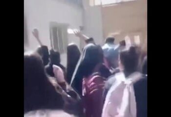 Schoolgirls in Iran chase off a director of education in a school.