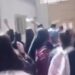 Schoolgirls in Iran chase off a director of education in a school.