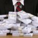 bonus pile of money hundred dollar bills benjamins cash