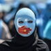 Women wearing mask in solidarity with Uyghur Muslims