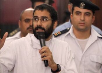 Alaa Abd el-Fattah speaking in court during his trial in Cairo in 2014.