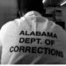 An image of an inmate wearing a uniform with the inscription, "Alabama Dept. of Corrections."