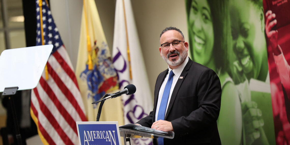 Man speaking at lectern