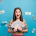 money raises Close-up portrait of her she nice lovely pretty amazed crazy overjoyed cheerful cheery girl holding in hand fan cashback sale discount isolated over bright vivid shine vibrant blue color background