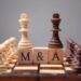 m&a merger King Chess Pieces With Mergers And Acquisitions Text