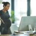 Shot of a pregnant businesswoman working in an office Tying together some loose ends before maternity leave