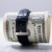 Rolled Up Dollar Banknotes Tied With Belt