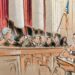 Sketch of the justices speaking animatedly to the bespectacled woman at the podium.