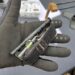 The ETQ (Everyday Carry Tourniquet) Tourniquet from Snakestaff Systems is a keychain-sized TQ with a full-sized textured windlass and a carabiner closure. The yellow item in the photo is an attached chemlight.