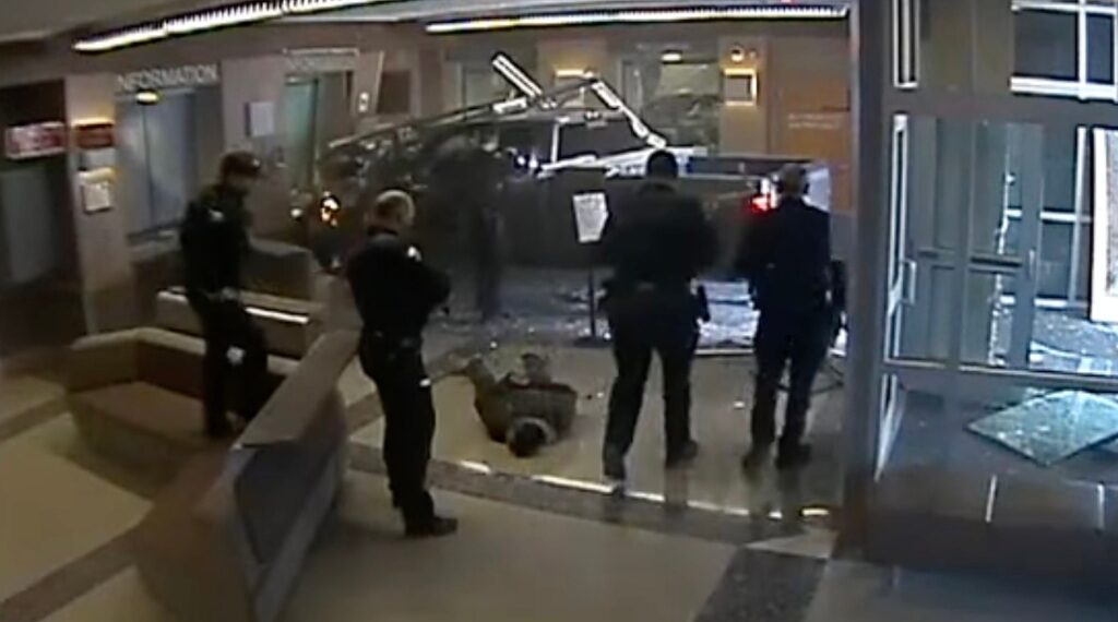 Officers immediately had their guns drawn when the vehicle plowed through the front glass doors at the station on Jan. 25, 2023.