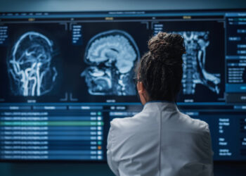 doctor looking atbrain injury scans