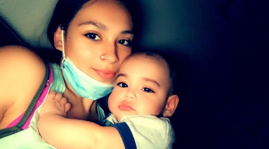 Alissa Parraz, 16,cuddling her baby boy, Nycholas Nolan Parraz.