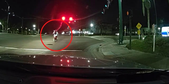 Joshua Richardson is seen flipping police officers off seconds before he was hit by a truck in an intersection.