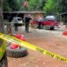 Investigators comb a property outside Wilderville, Ore., on Saturday, May 30, 2015.