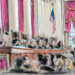 Sketch of the courtroom as the bespectacled man at the podium exchanges words with Justice Barrett.